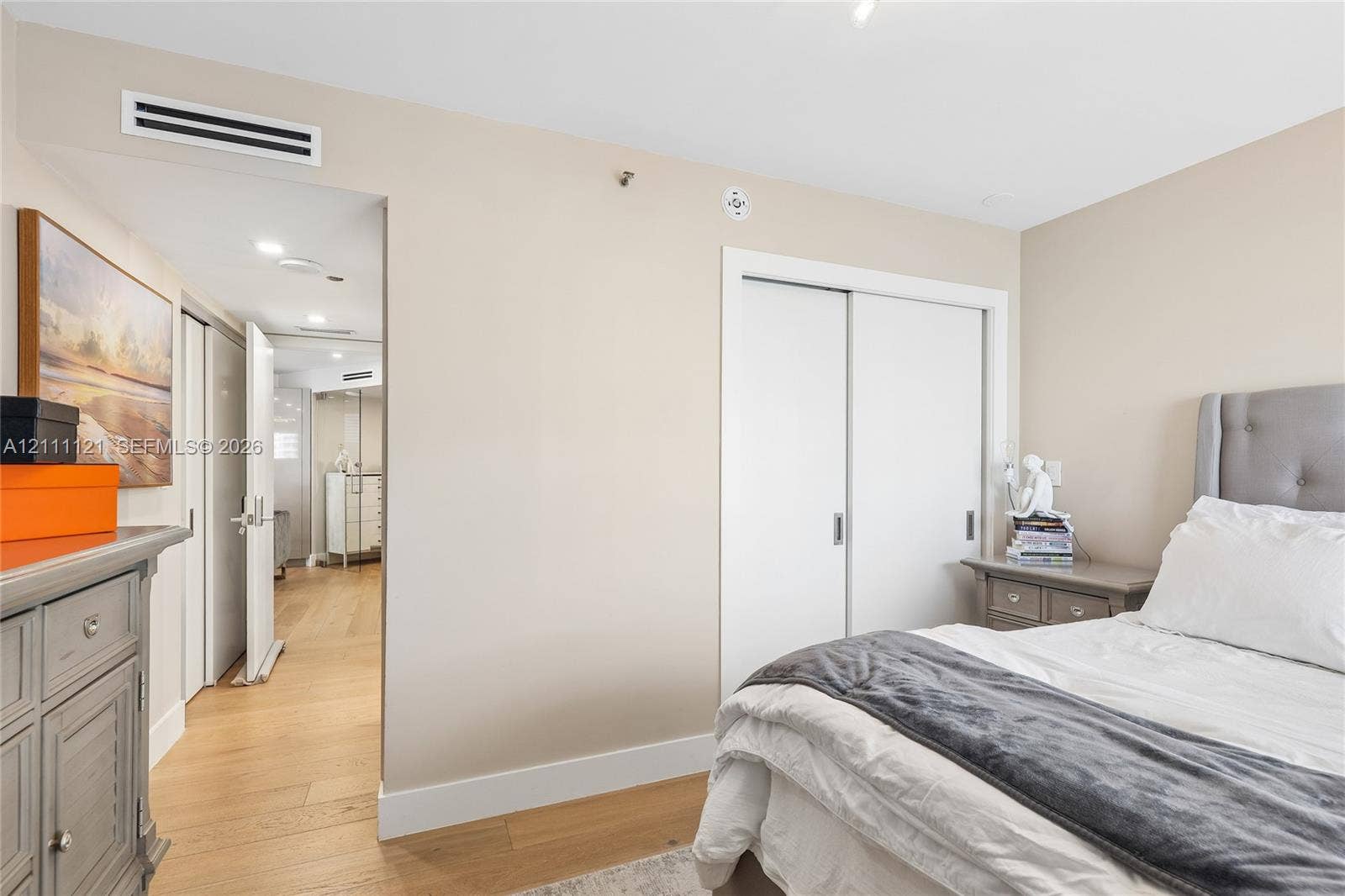3300 NE 192nd Street, #1813, Aventura, FL 33180 Neutral-toned interior featuring wood-finish flooring, recessed lighting, and a double-door sliding closet