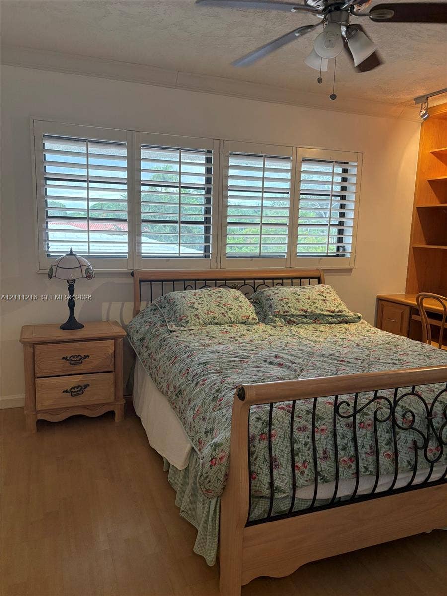 525 Coral Way, #303, Coral Gables, Coral Gables, FL 33134 Wood-finish flooring, plantation shutters, and built-in floor-to-ceiling cabinetry with an integrated desk
