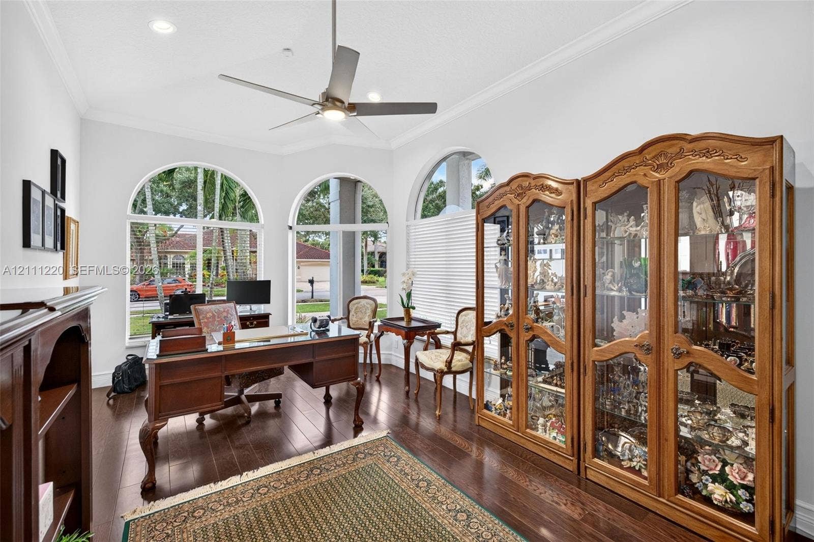 134 Dockside Terrace, Weston, FL 33327 Wood-finish flooring, recessed lighting, ceiling fan, and arched windows with crown molding