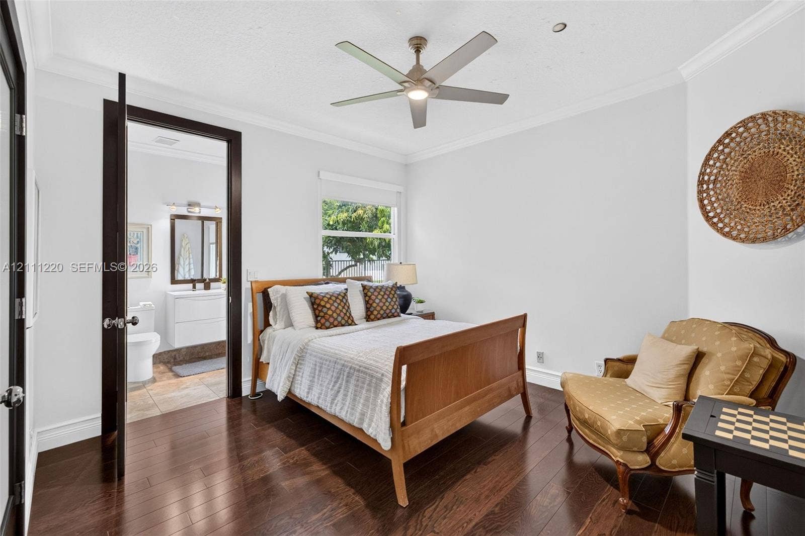 134 Dockside Terrace, Weston, FL 33327 Dark wood-finish flooring, recessed lighting, crown molding, and a modern ceiling fan with integrated lighting
