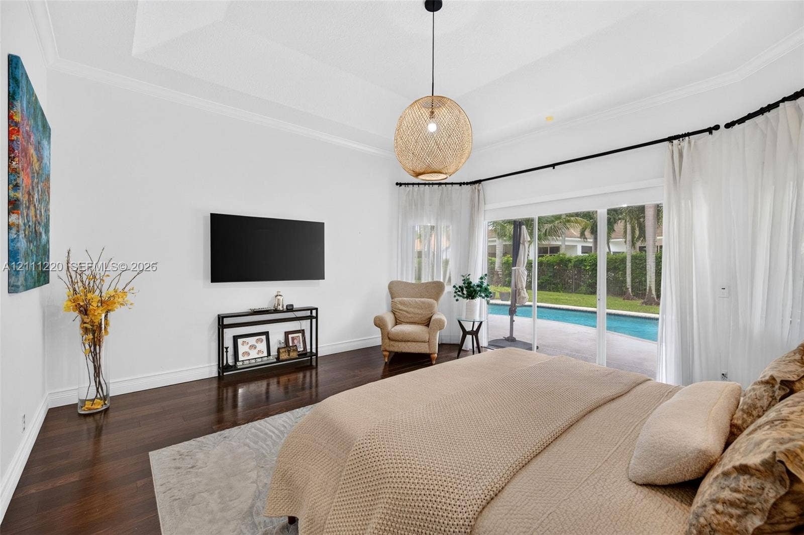 134 Dockside Terrace, Weston, FL 33327 Tray ceiling, dark wood-finish flooring, and woven spherical pendant lighting