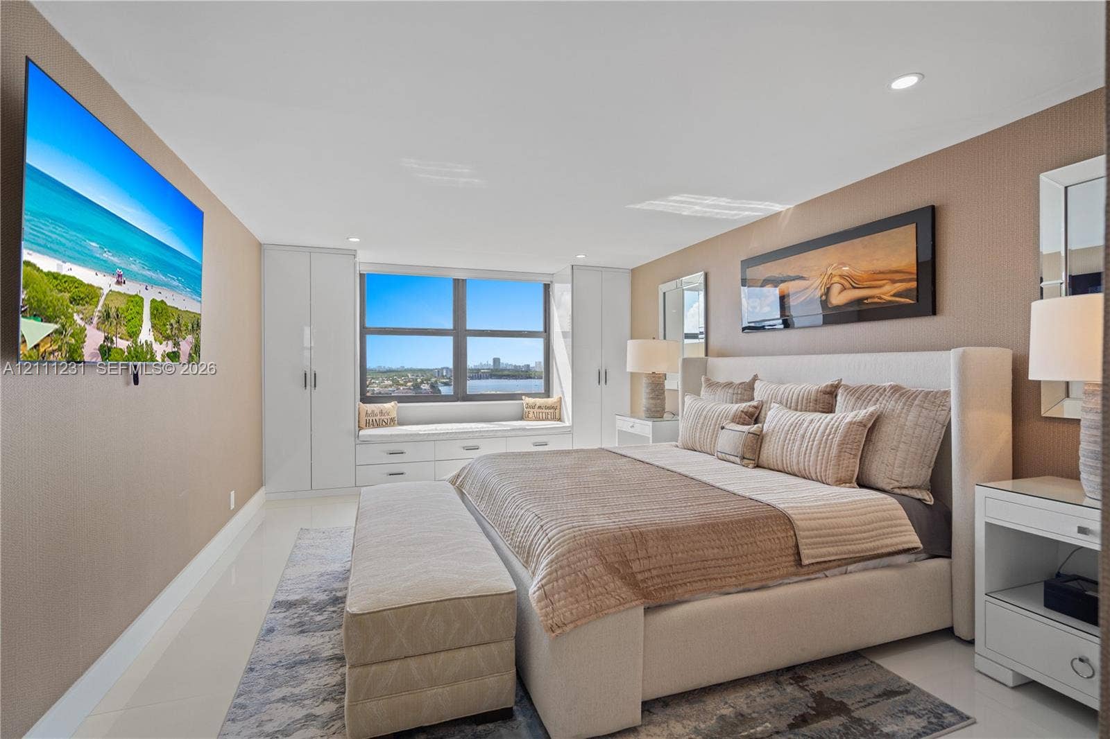 Built-in floor-to-ceiling cabinetry, recessed lighting, and a custom window seat featuring integrated drawers