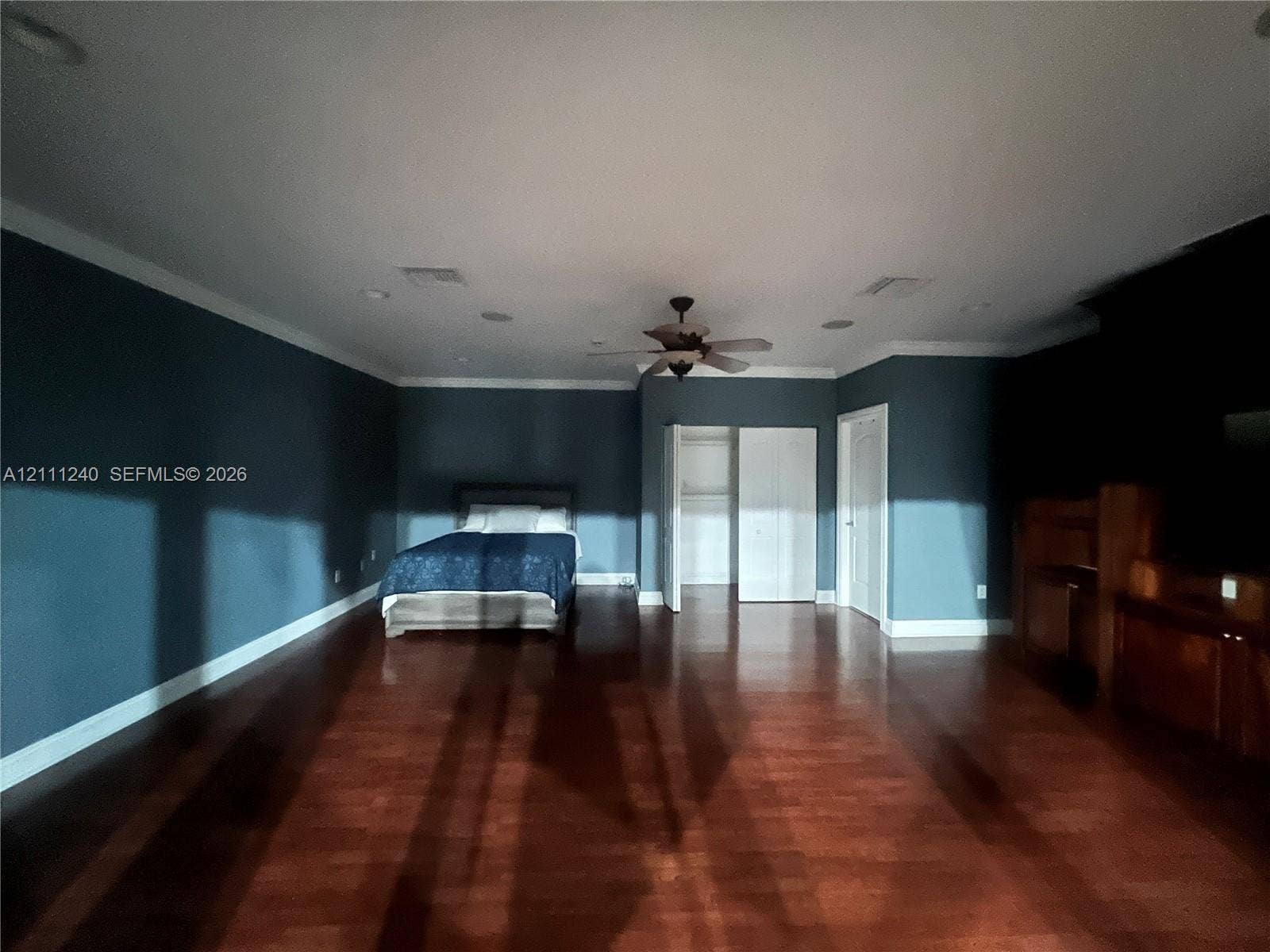 1430 Polk Street, Hollywood, Hollywood, FL 33020 Spacious room featuring wood-finish flooring, crown molding, recessed lighting, and a ceiling fan