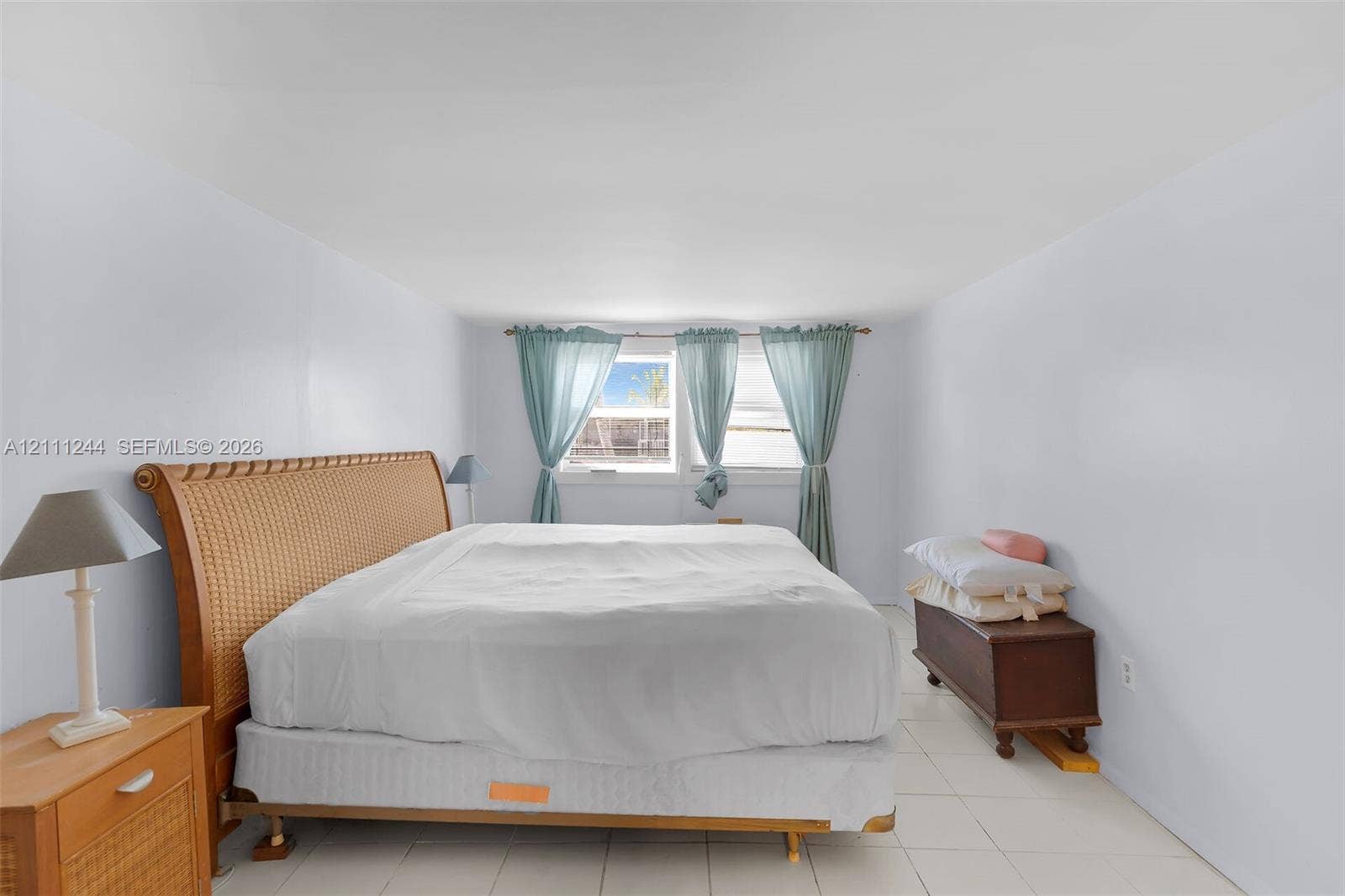 Interior room featuring large-format ceramic tile flooring and white wall finishes