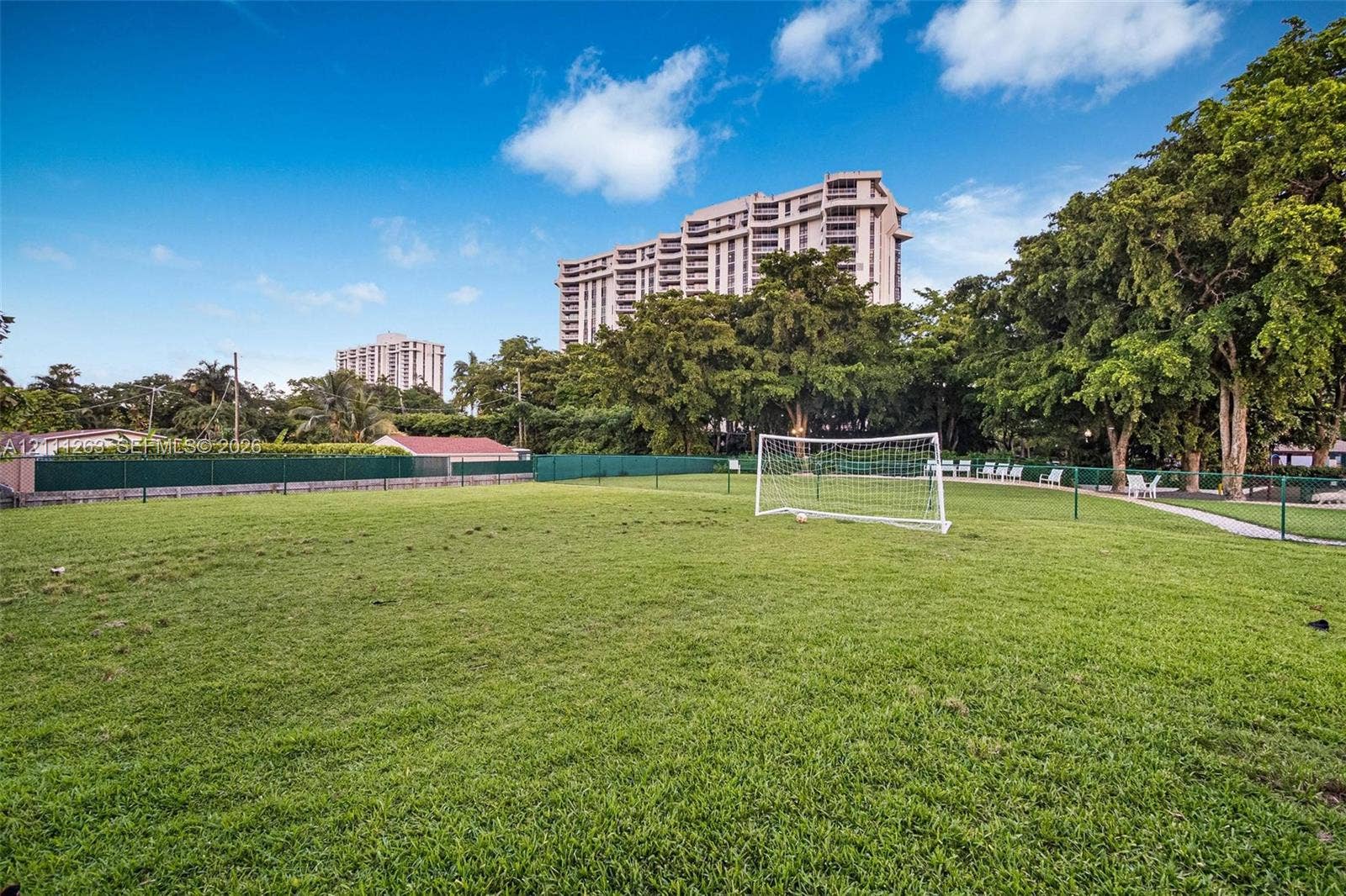 4000 Towerside Terrace, #604, Miami, FL 33138 Expansive grass field featuring a perimeter fence and a built-in soccer goal