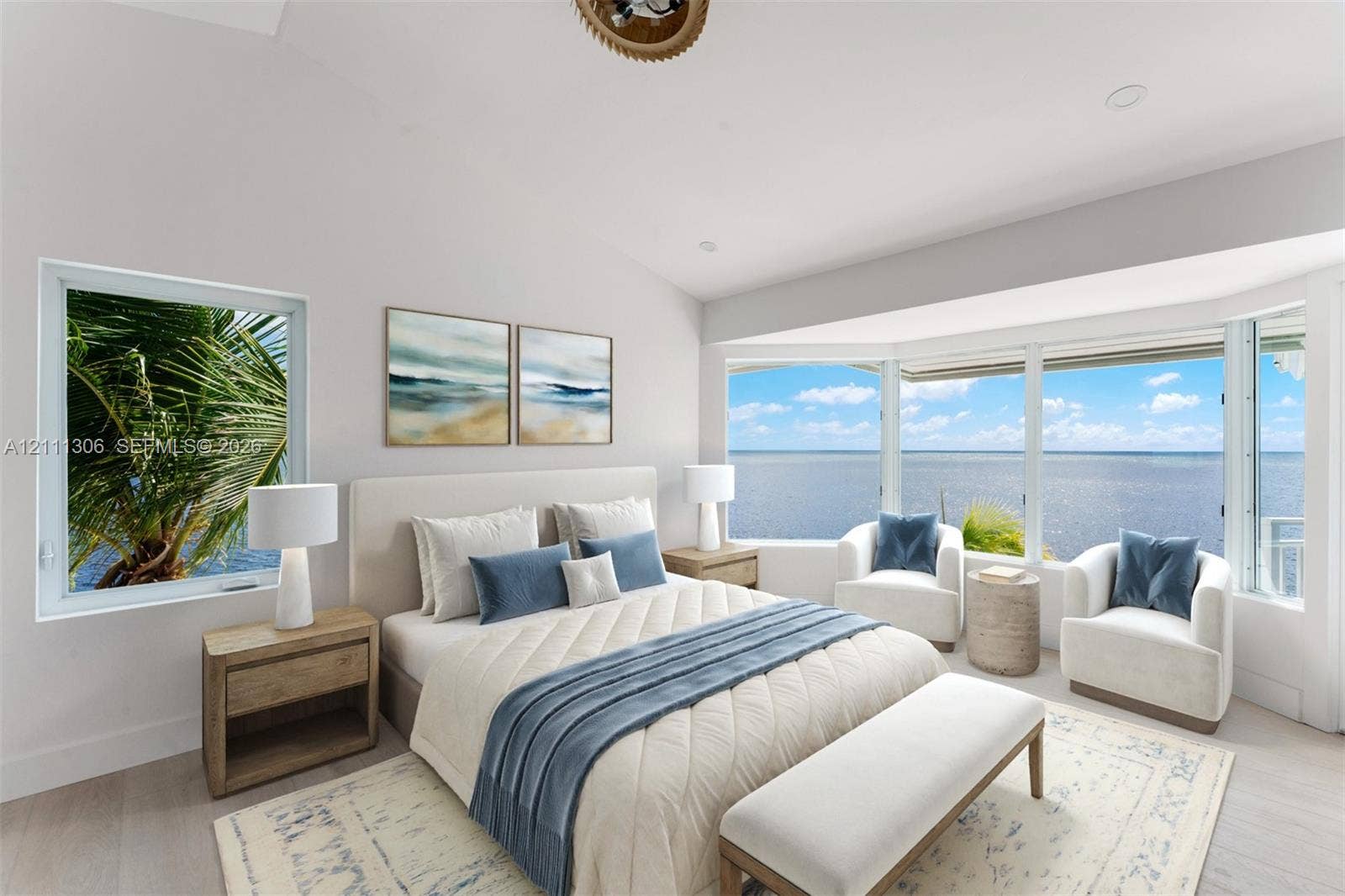 Vaulted ceilings, expansive bay windows, and light-toned wood-finish flooring