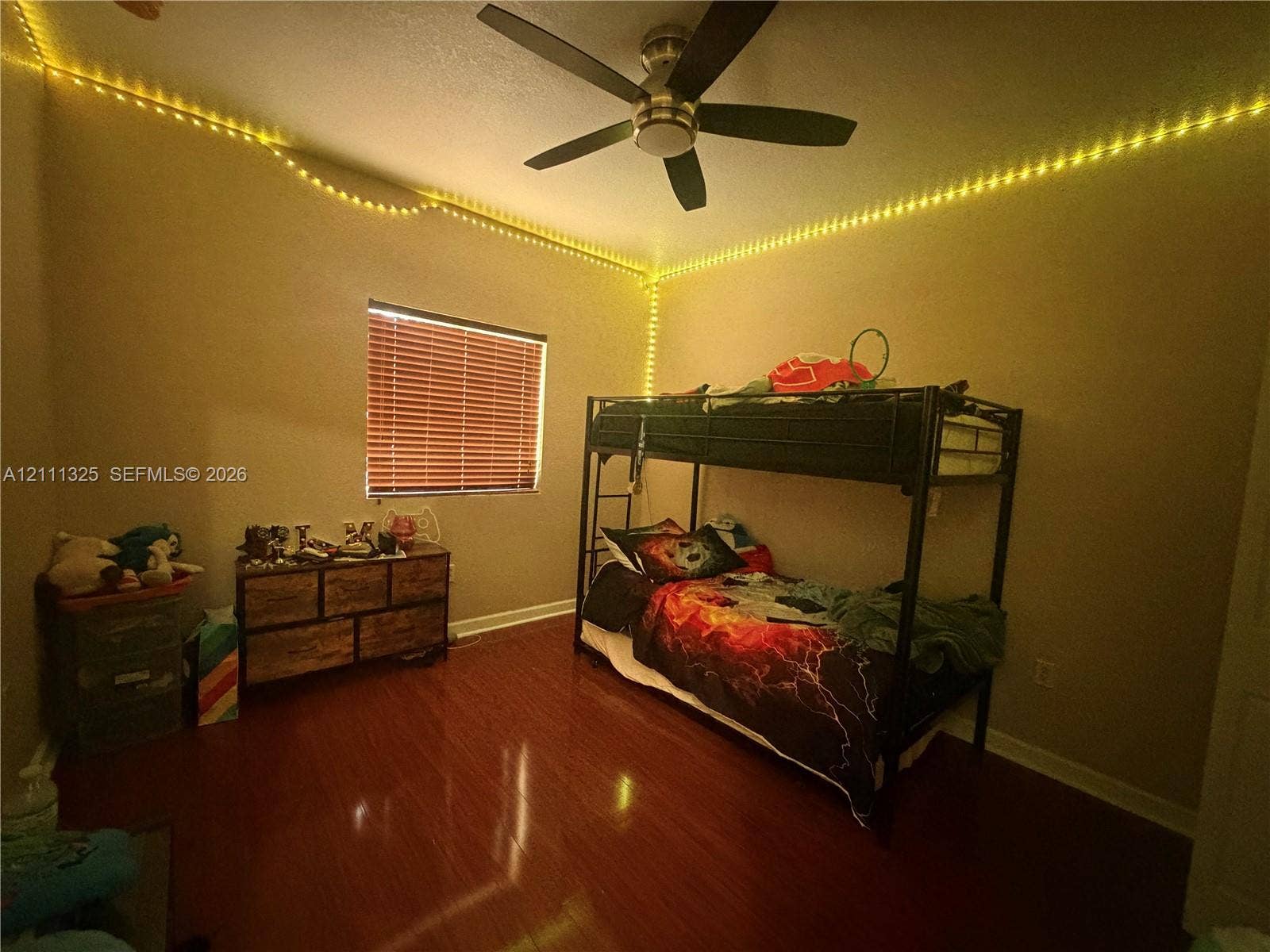 18172 SW 108th Path, Miami, Miami, FL 33157 Interior room featuring wood-finish flooring, a ceiling fan with integrated lighting, and a window with horizontal blinds