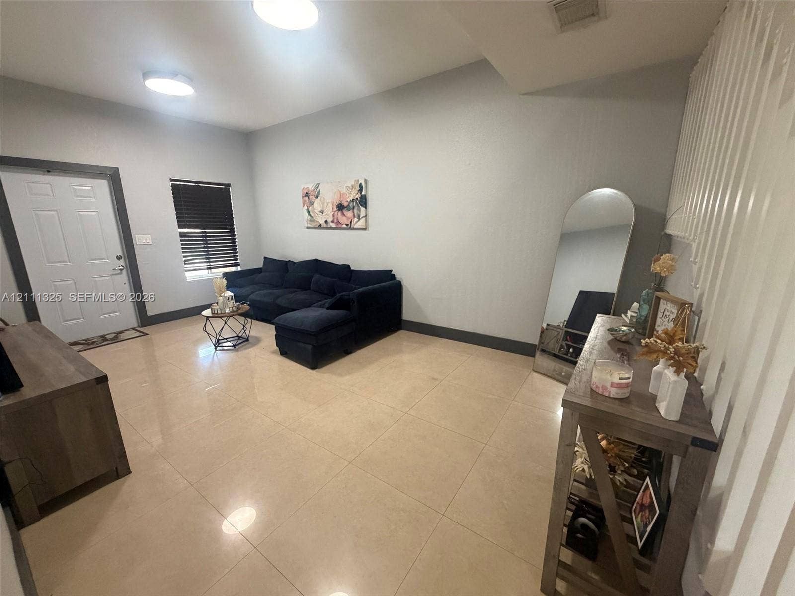 18172 SW 108th Path, Miami, Miami, FL 33157 Large-format tile flooring, flush-mount ceiling lighting, and a multi-paneled entry door with dark trim accents