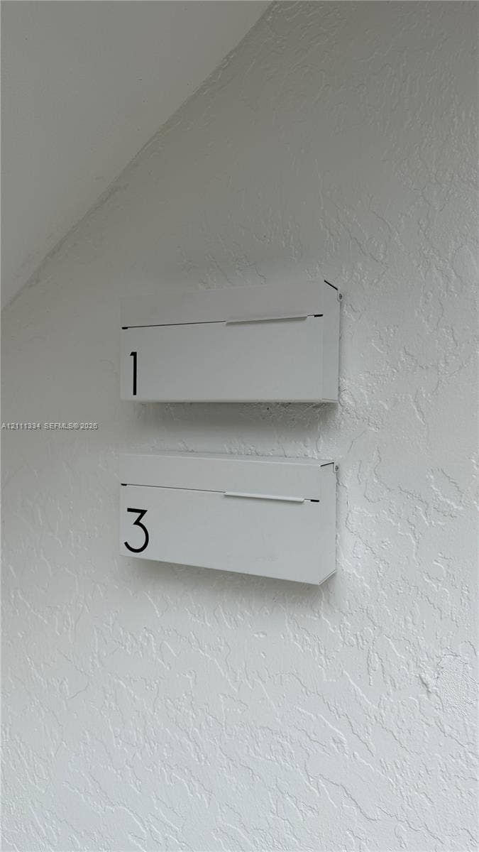 3314 NW 8th, #1, Miami, Miami, FL 33131 Wall-mounted, matte-finished white metal mailboxes featuring minimalist numeric lettering and a clean-lined rectangular design