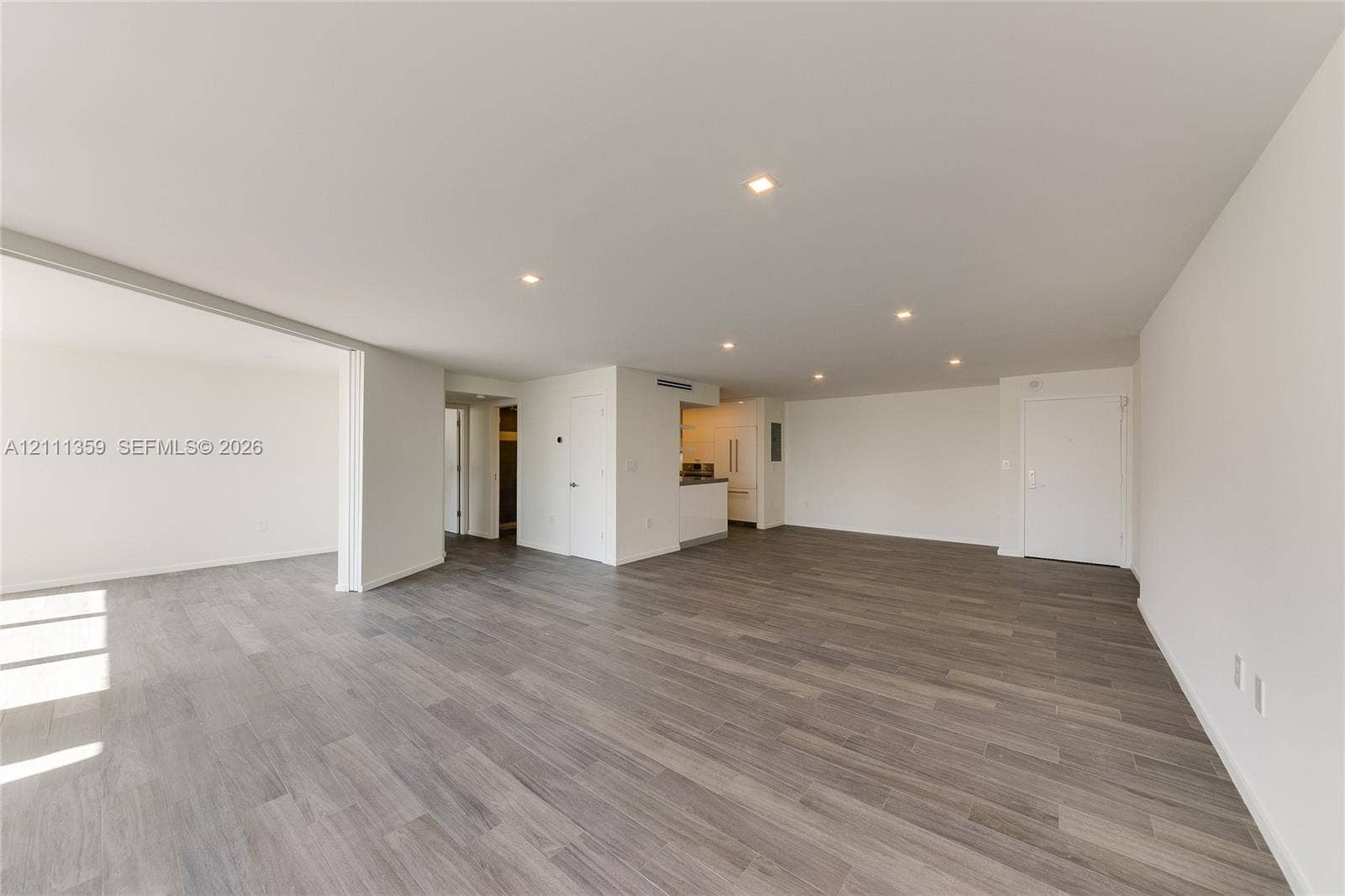 11 Island Avenue, #908, Miami Beach, Miami Beach, FL 33139 Open-concept interior featuring wood-finish flooring, recessed lighting, and neutral wall tones