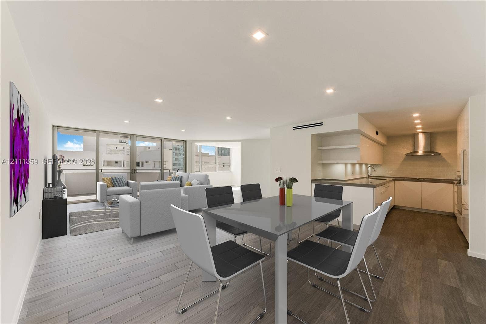11 Island Avenue, #908, Miami Beach, Miami Beach, FL 33139 Open-concept living space featuring wood-finish flooring, recessed lighting, floor-to-ceiling glass sliding doors, and a kitchen equipped with flat-panel cabinetry, a stainless steel range hood, and solid-surface countertops