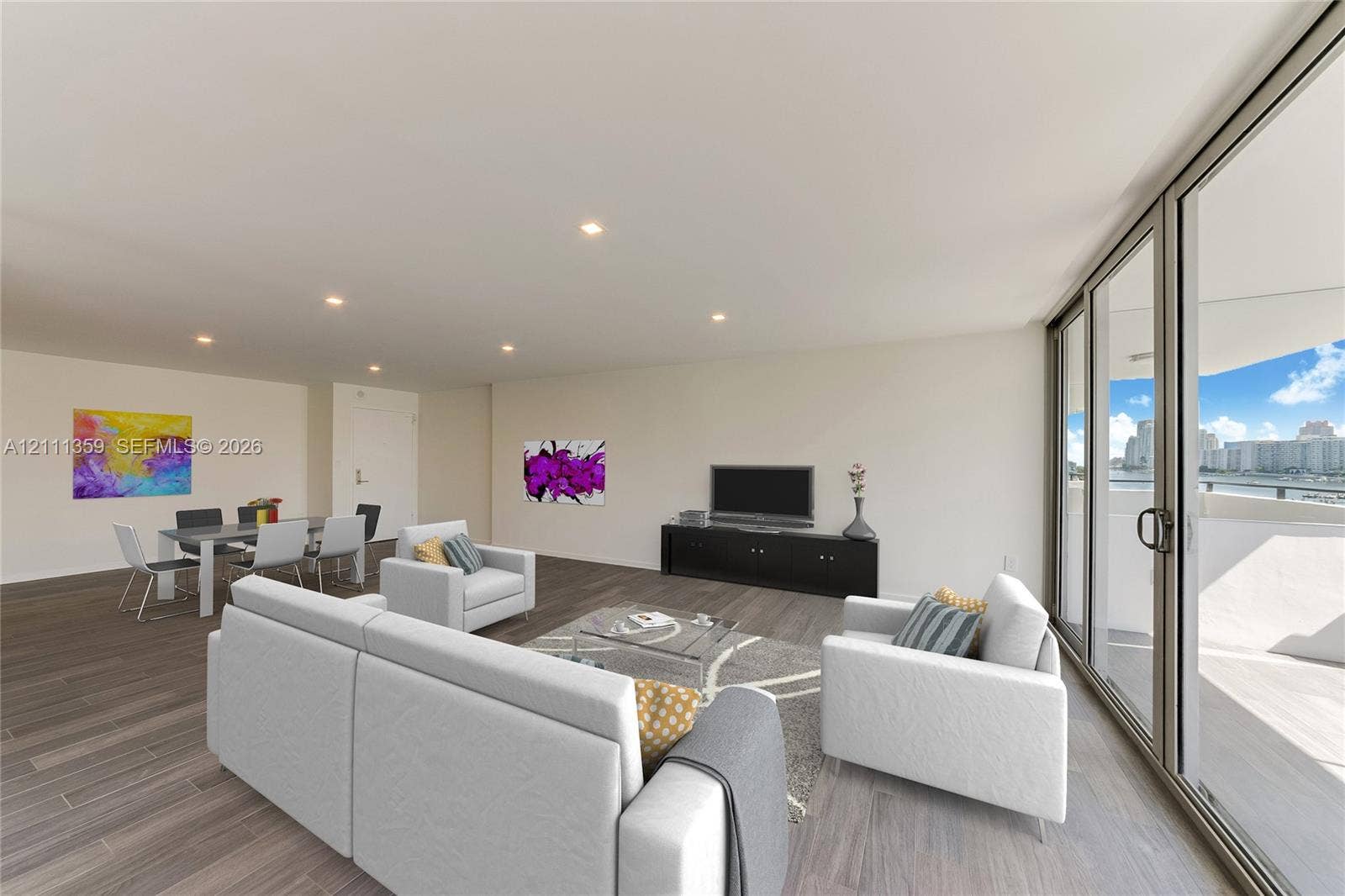 11 Island Avenue, #908, Miami Beach, Miami Beach, FL 33139 Open-concept floor plan featuring wood-finish flooring, recessed lighting, and expansive floor-to-ceiling sliding glass doors opening to a balcony