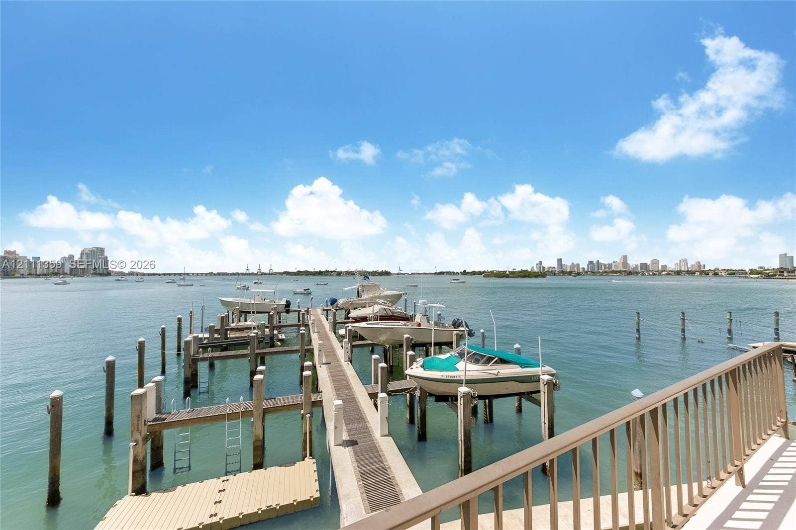 11 Island Avenue, #908, Miami Beach, Miami Beach, FL 33139 Waterfront dock featuring multiple boat slips, composite decking, and a metal railing system