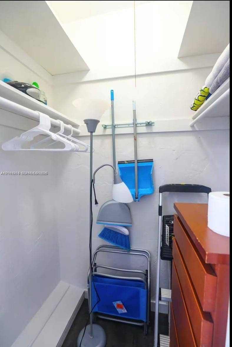 3710 Collins Avenue, #N-206, Miami Beach, FL 33140 Storage space featuring dual upper shelving and a clothes hanging rod