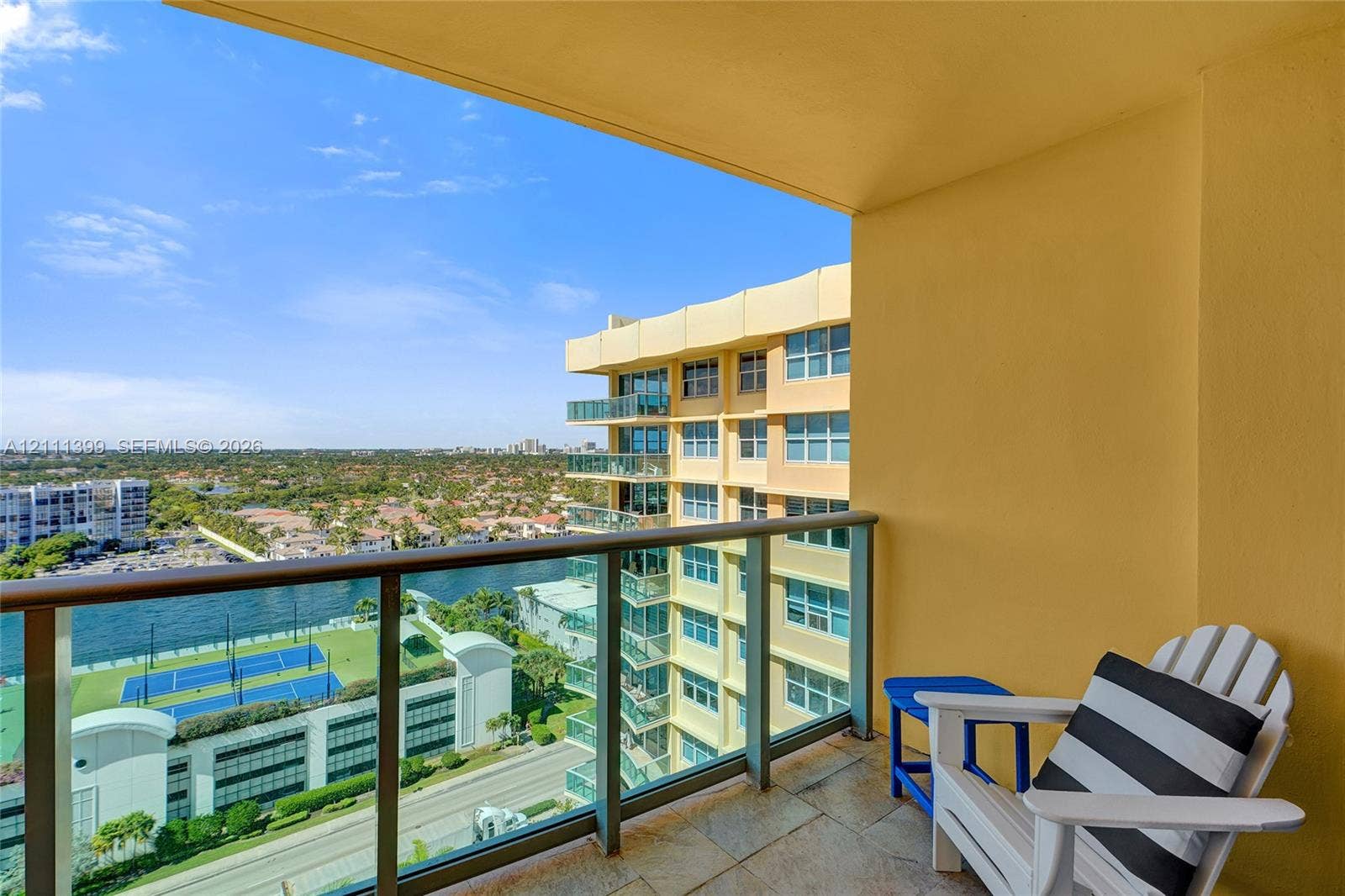 2501 S Ocean Drive, #1630, Hollywood, Hollywood, FL 33019 Covered balcony featuring stone-tile flooring and a metal railing with glass panels