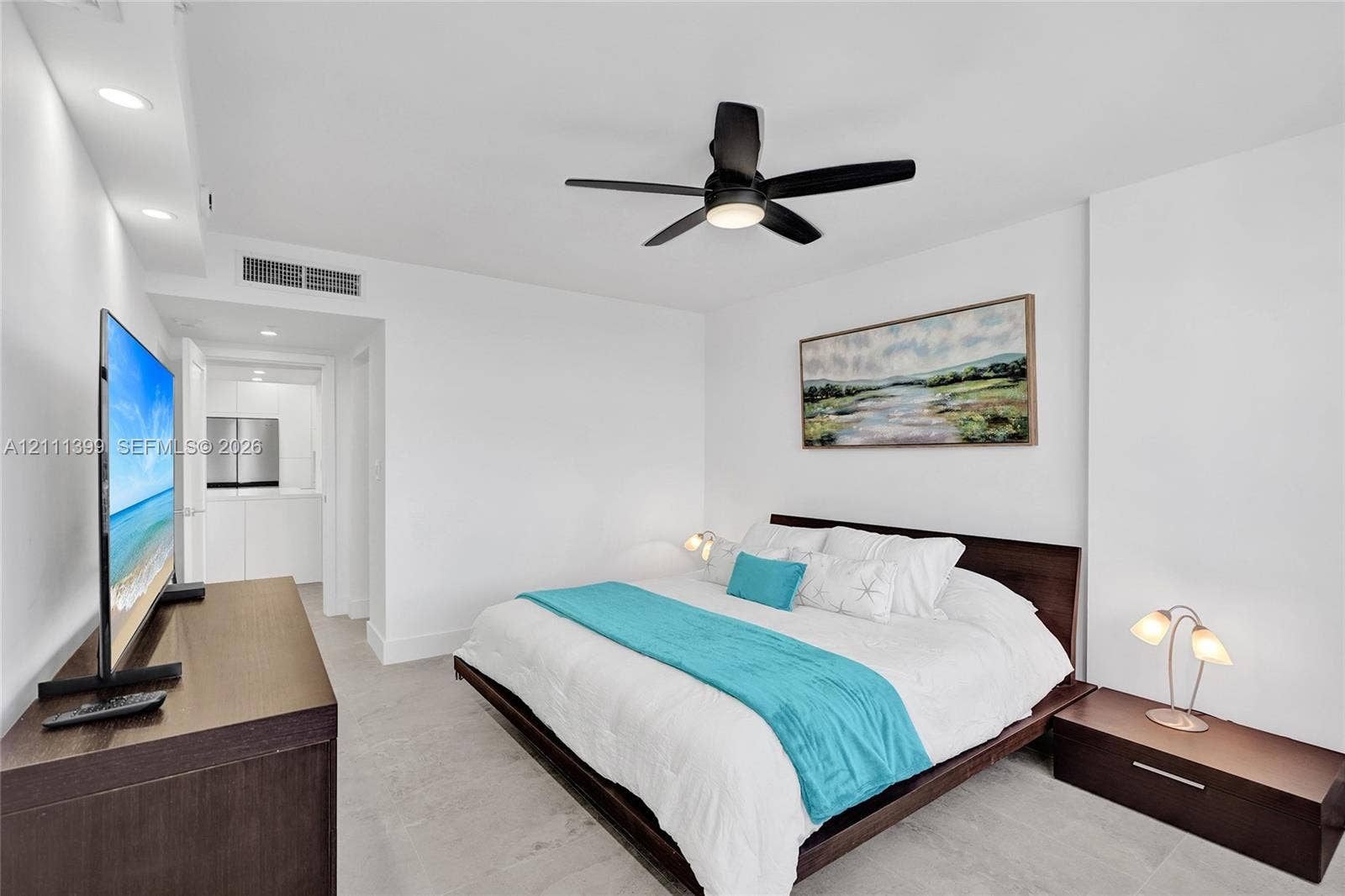 2501 S Ocean Drive, #1630, Hollywood, Hollywood, FL 33019 Neutral interior featuring light-toned flooring, recessed ceiling lighting, and a modern black multi-blade ceiling fan