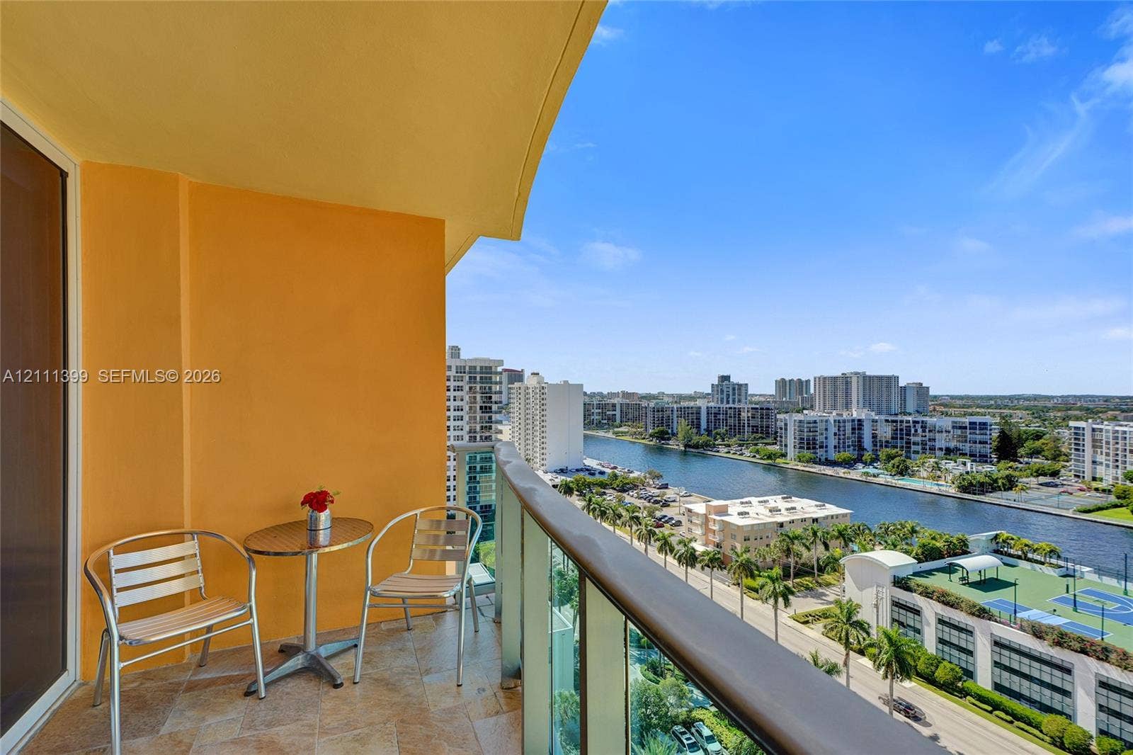 2501 S Ocean Drive, #1630, Hollywood, Hollywood, FL 33019 Private balcony featuring stone-tiled flooring and a glass-panel railing with a metallic handrail
