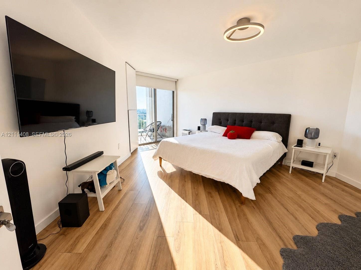 1700 N River Drive, #1004, Miami, FL 33125 Hallway featuring large-format ceramic tile flooring, recessed ceiling lighting, and a built-in closet with panel doors