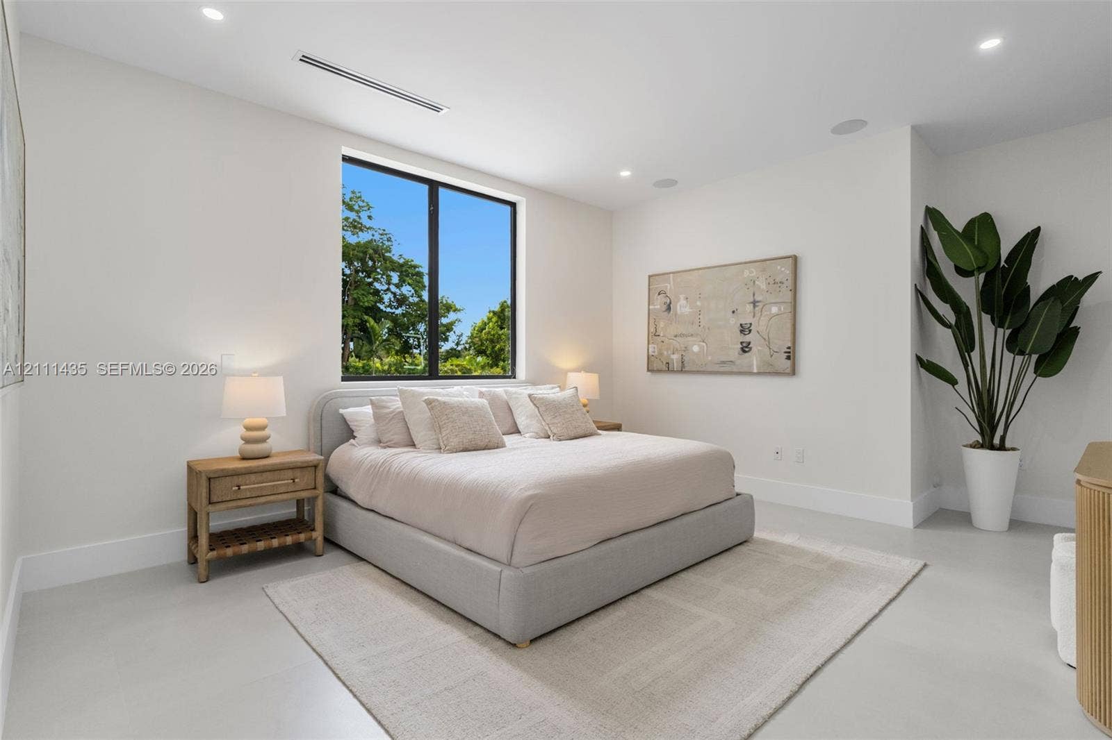 9530 SW 95th Court, Miami, FL 33176 Neutral interior featuring high ceilings with recessed lighting, large window with black frame, and polished concrete flooring