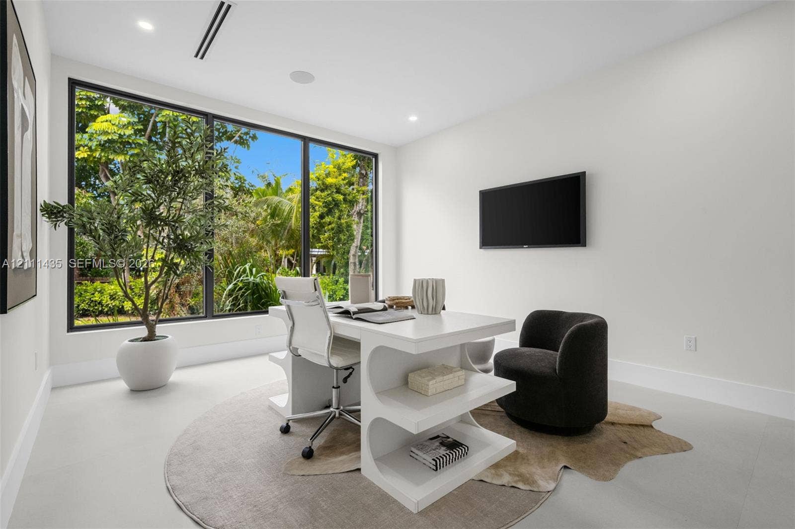 9530 SW 95th Court, Miami, FL 33176 Large format floor-to-ceiling window with black trim, recessed lighting, and smooth-finish flooring