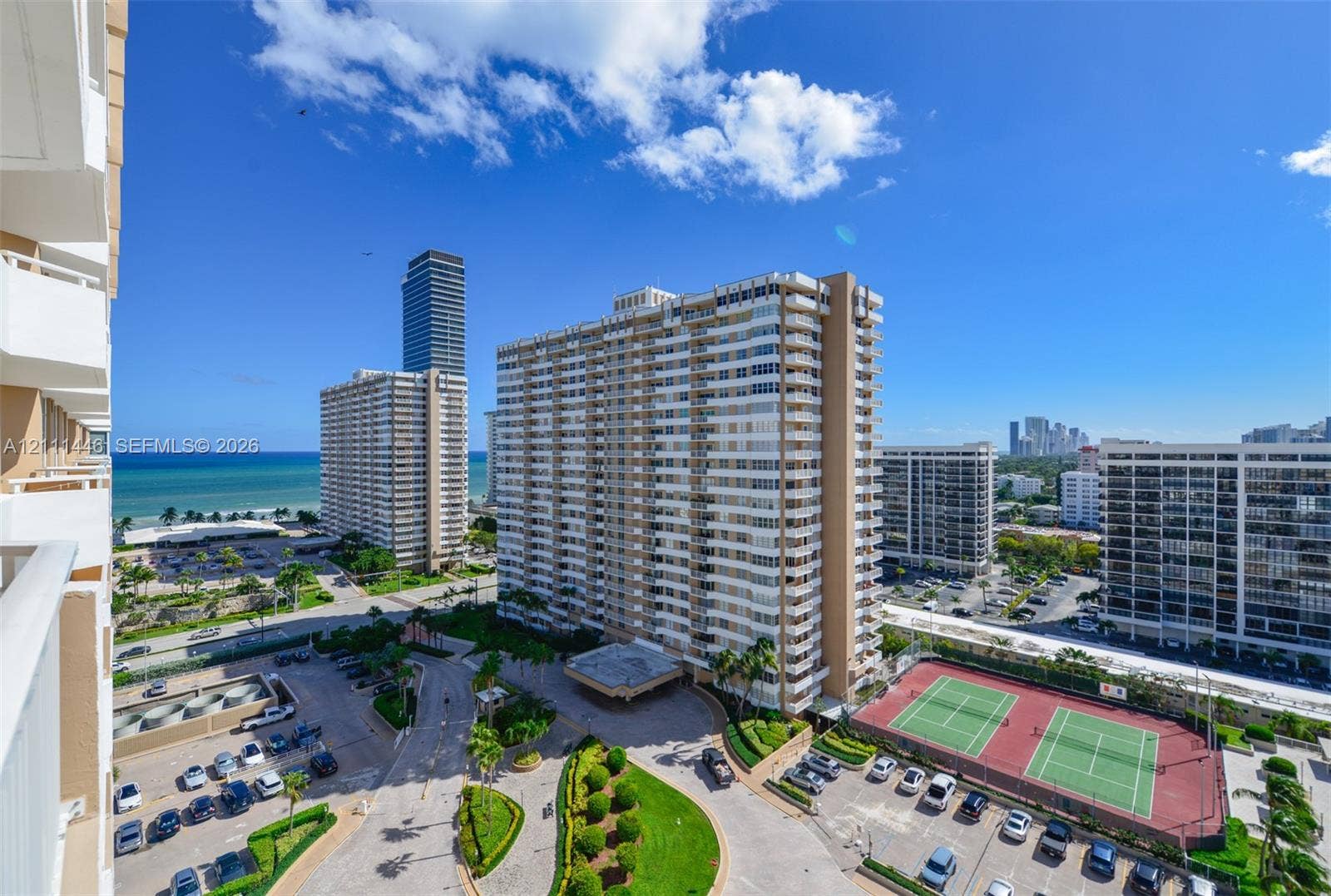 1965 S Ocean Drive, #15M, Hallandale Beach, Hallandale Beach, FL 33009 High-rise residential exterior with multi-level private balconies, outdoor tennis courts, landscaped grounds, and proximity to the coastline