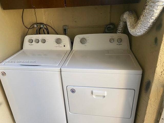 11101 Royal Palm Boulevard, #113, Coral Springs, Coral Springs, FL 33065 Laundry area equipped with a top-loading washer and front-loading dryer
