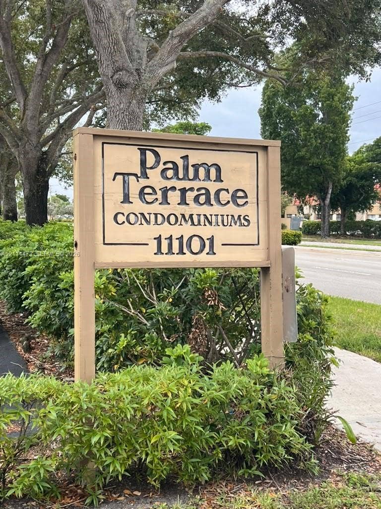 11101 Royal Palm Boulevard, #113, Coral Springs, Coral Springs, FL 33065 Freestanding monument sign featuring a wood-frame construction with inset professional lettering