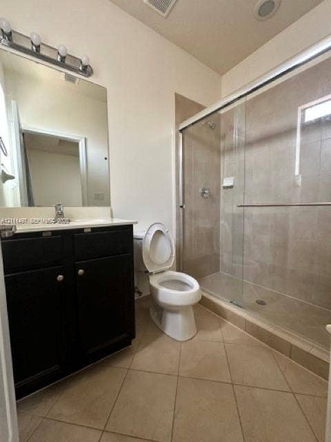 3210 SE 6th Street, Homestead, Homestead, FL 33033 Dark wood-finish vanity with a light-toned countertop, glass-enclosed shower featuring neutral wall tile, and diagonal tile flooring