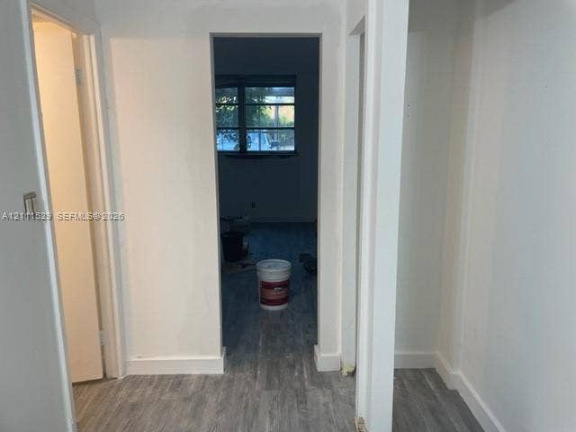 406 NW 68th Avenue, #118, Plantation, Plantation, FL 33317 Interior hallway featuring white wall finishes and wood-finish flooring