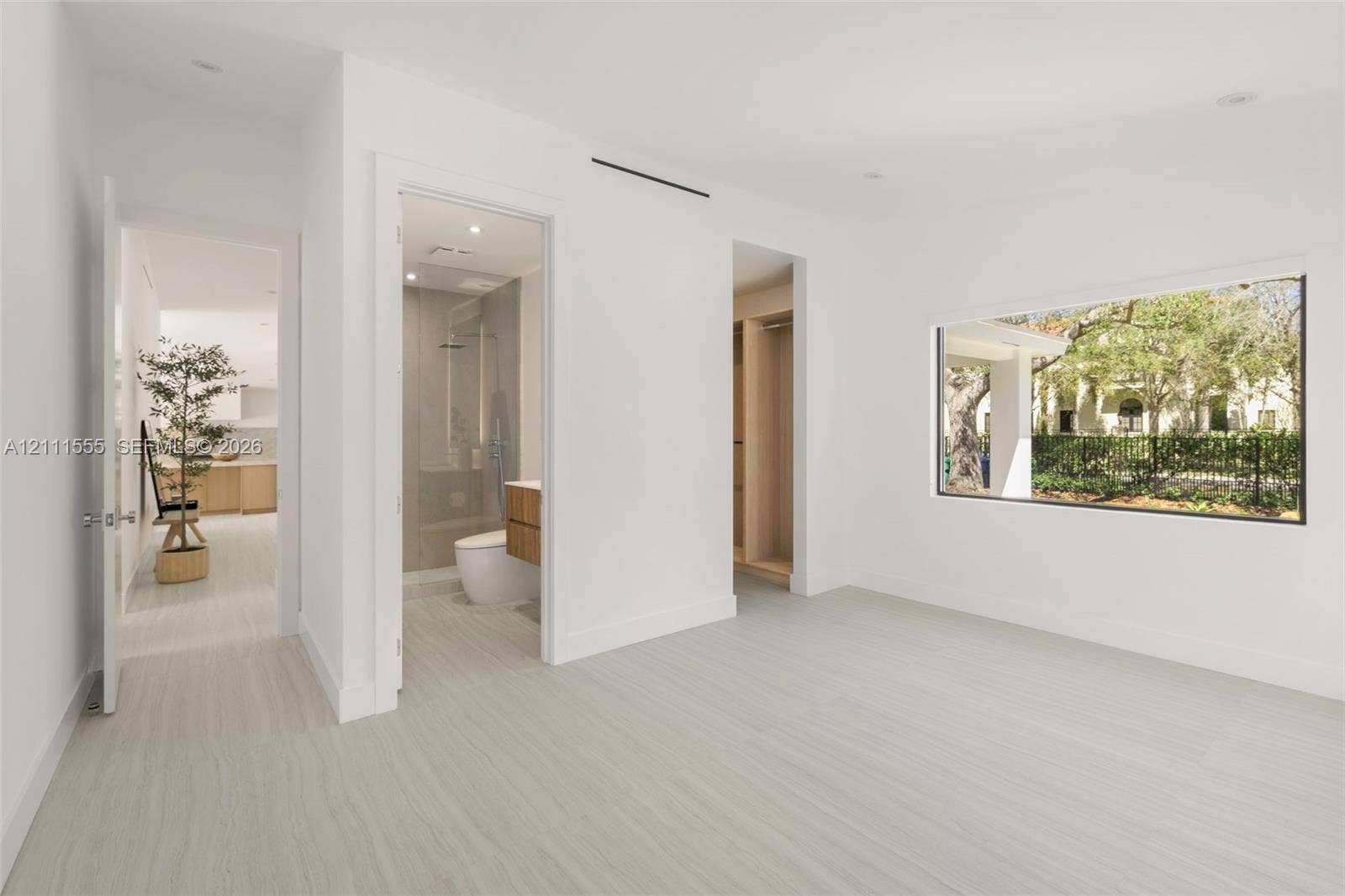 8800 SW 118th Street, Miami, Miami, FL 33176 Interior room featuring wood-finish flooring, recessed lighting, expansive picture window, and built-in closet cabinetry