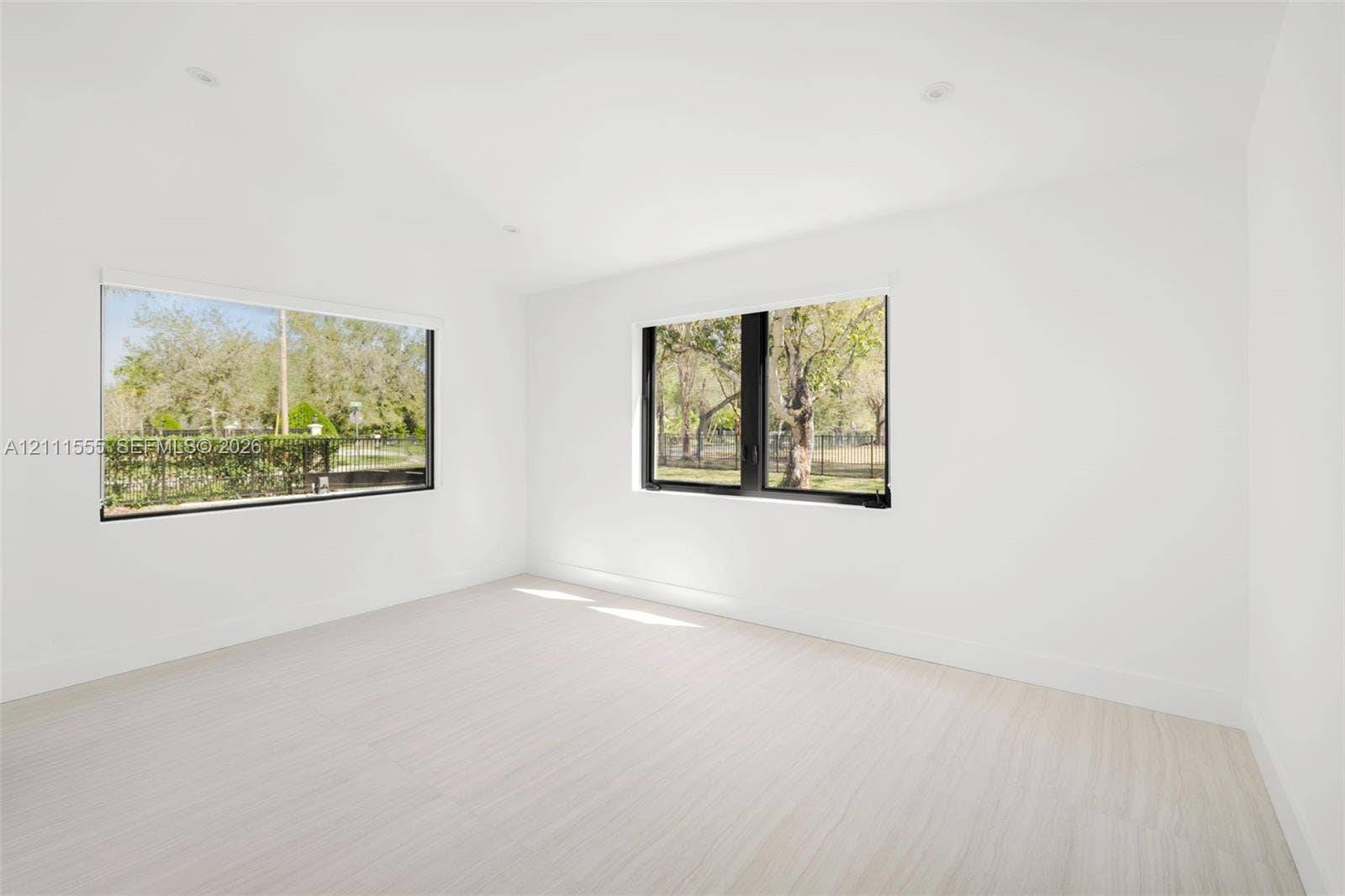 8800 SW 118th Street, Miami, Miami, FL 33176 Bright room featuring wood-finish flooring, recessed lighting, and large windows with black frames