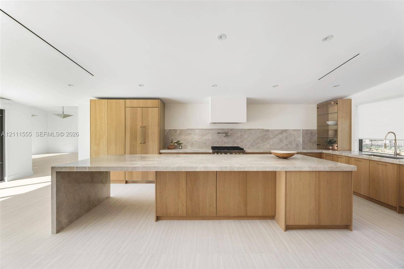 8800 SW 118th Street, Miami, Miami, FL 33176 Kitchen featuring custom light wood cabinetry, stone countertops with a waterfall edge island, a built-in range hood, stone backsplash, and recessed lighting