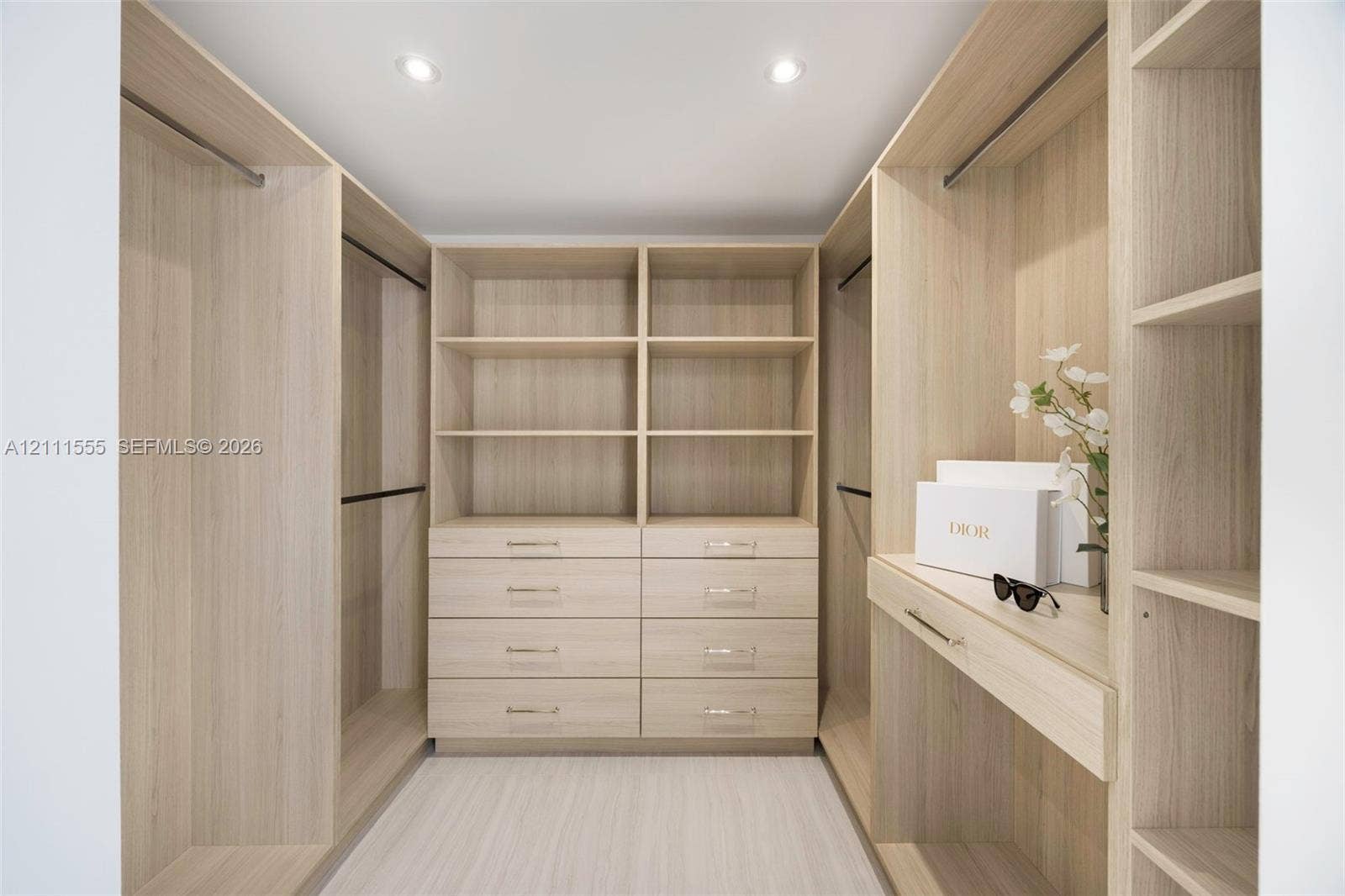 8800 SW 118th Street, Miami, Miami, FL 33176 Primary Closet - Hers Custom wood-finish walk-in closet featuring floor-to-ceiling shelving, integrated drawer banks, hanging rods, and recessed lighting