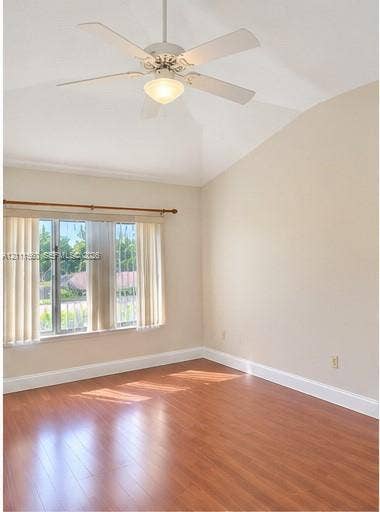3539 W Inverrary Boulevard W, #1, Lauderhill, Lauderhill, FL 33319 Vaulted ceilings, wood-finish flooring, and a central ceiling fan with an integrated light fixture, complemented by large windows with horizontal blinds