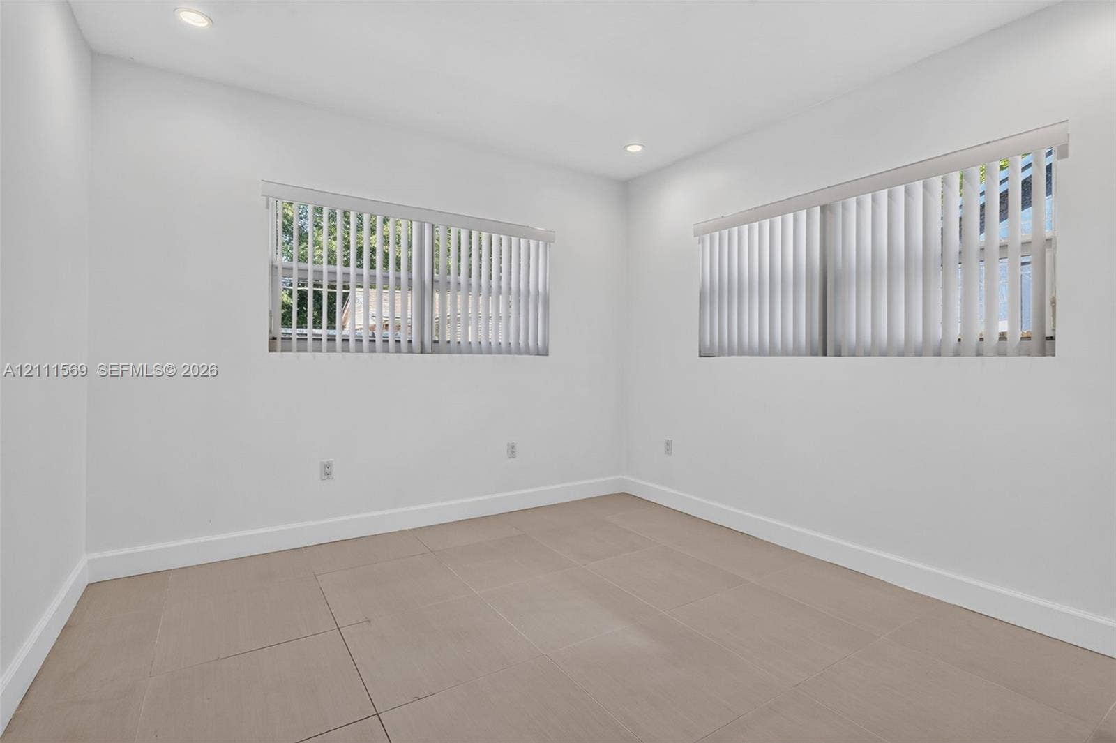 12800 NE 11th Avenue, #4, North Miami, North Miami, FL 33161 Neutral-toned tile flooring, recessed ceiling lighting, and windows featuring vertical blinds