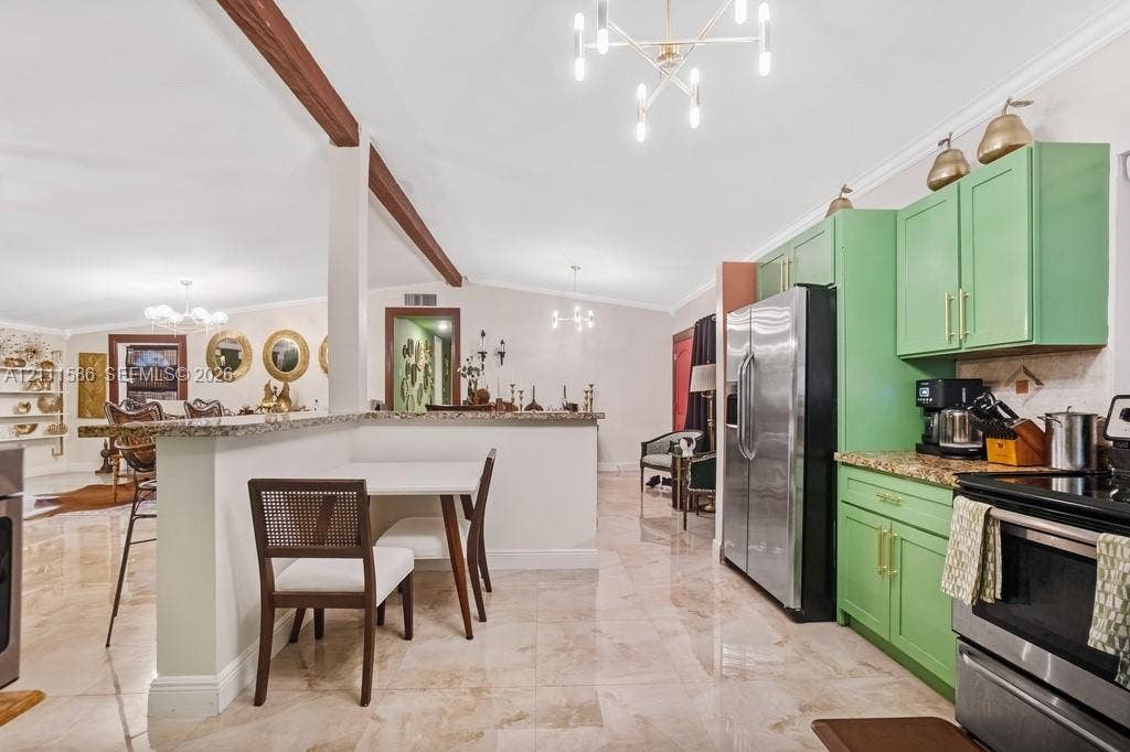 20431 NE 14th Court, Miami, FL 33179 Kitchen featuring custom green cabinetry, stone countertops, stainless steel appliances, polished tile flooring, and modern multi-light chandeliers