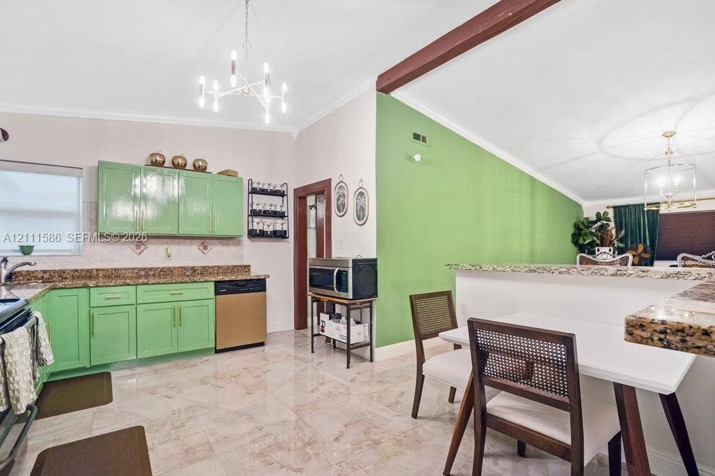 20431 NE 14th Court, Miami, FL 33179 Kitchen featuring stone countertops, a multi-arm chandelier, polished tile flooring, and an exposed structural ceiling beam
