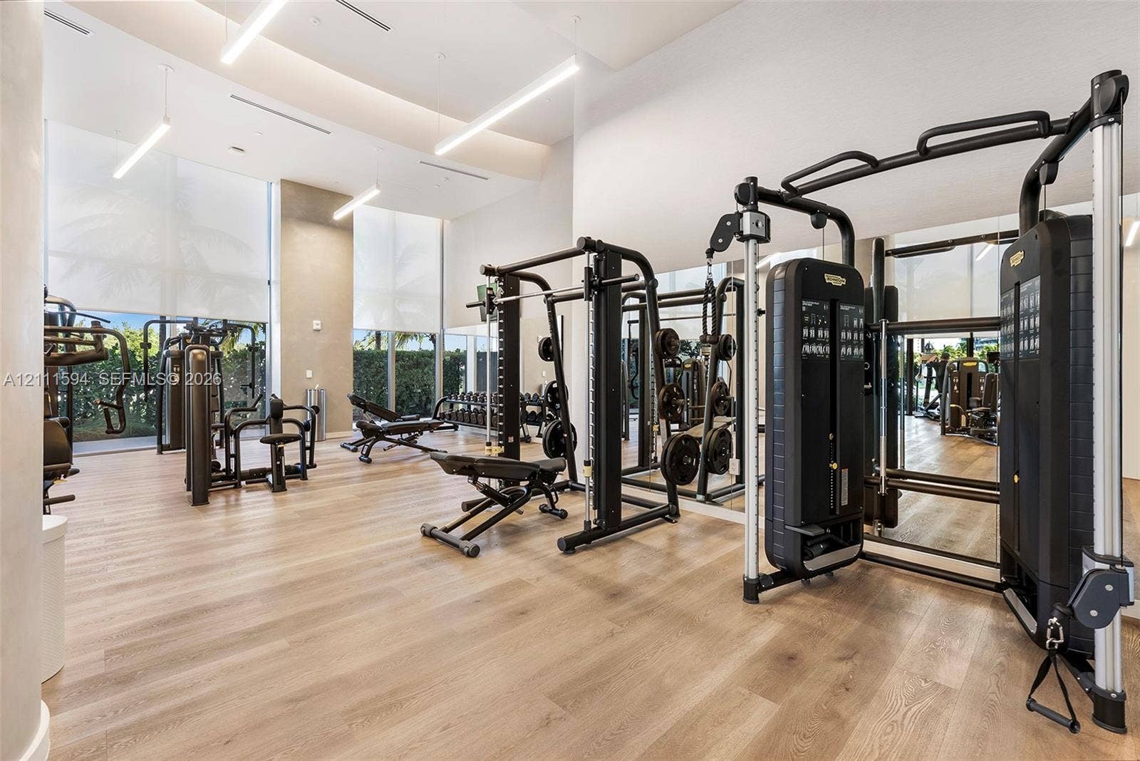 2411 Laguna Circle, #2506, North Miami, FL 33181 Fitness center featuring wood-finish flooring, floor-to-ceiling windows, and recessed lighting