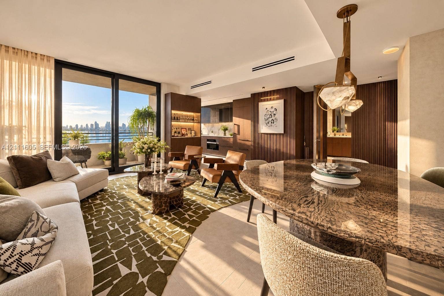 Open-concept floor plan featuring floor-to-ceiling glass sliding doors, recessed linear lighting, custom dark wood-finish cabinetry, and a geometric pendant light fixture