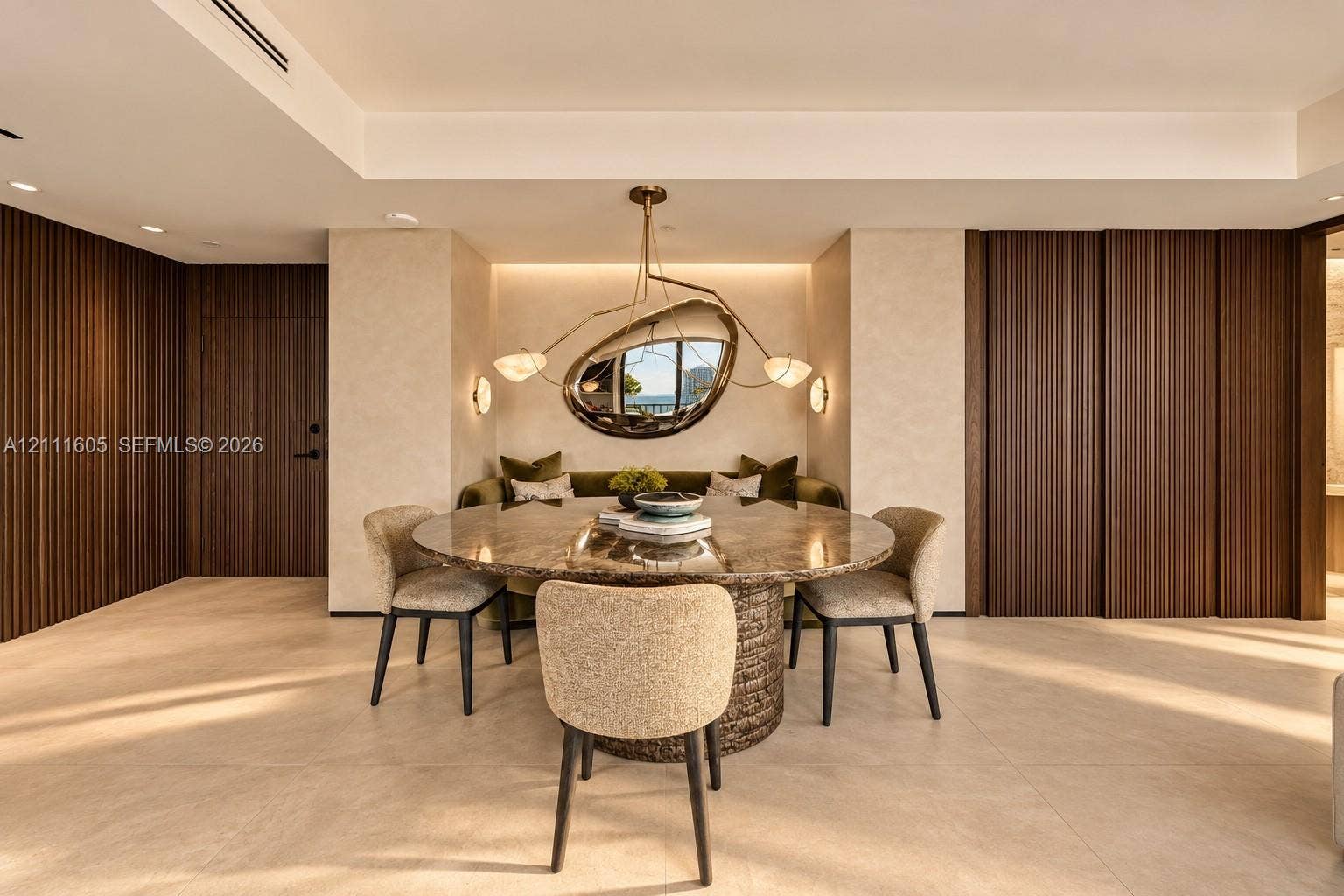 Vertical slat wood wall paneling, integrated recessed ceiling lighting, large-format tile flooring, and full-height sliding wooden doors