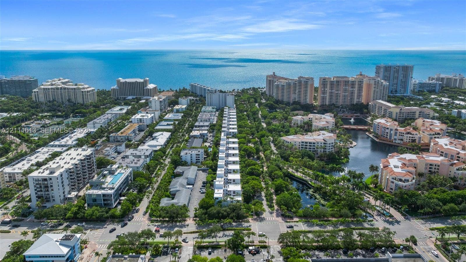 Aerial perspective featuring coastal surroundings, mature tropical vegetation, and proximity to the open water