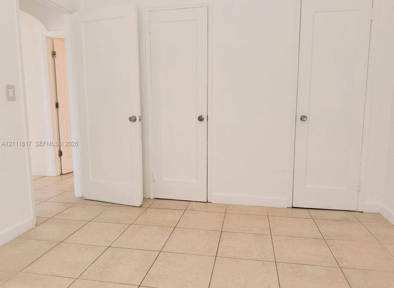 Ceramic tile flooring throughout and three solid-core interior doors with satin finish hardware