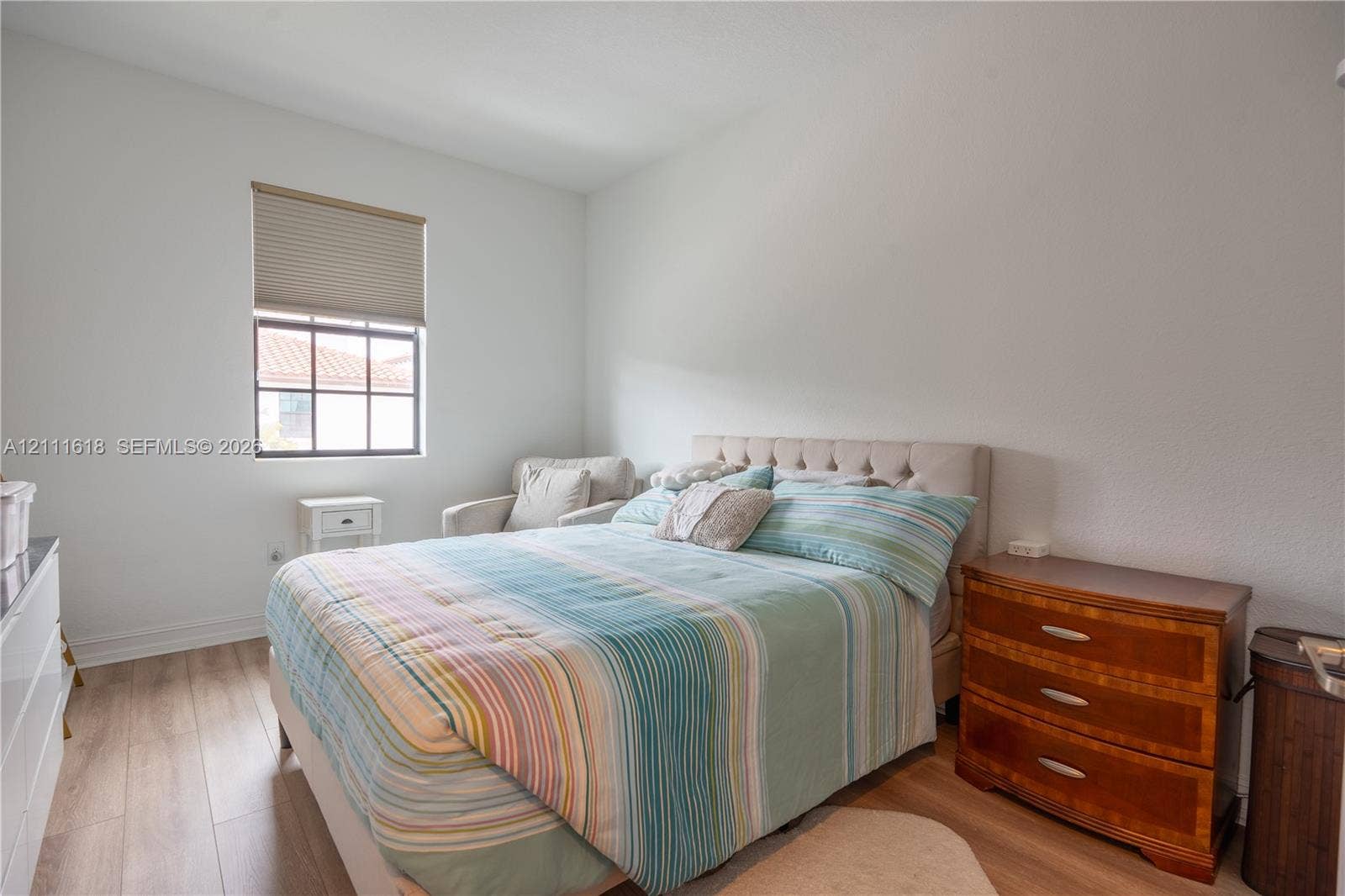 1423 SW 115th Avenue, #NA, Pembroke Pines, Pembroke Pines, FL 33025 Wood-finish flooring, multi-pane window with top-down cellular shade, and neutral wall tones