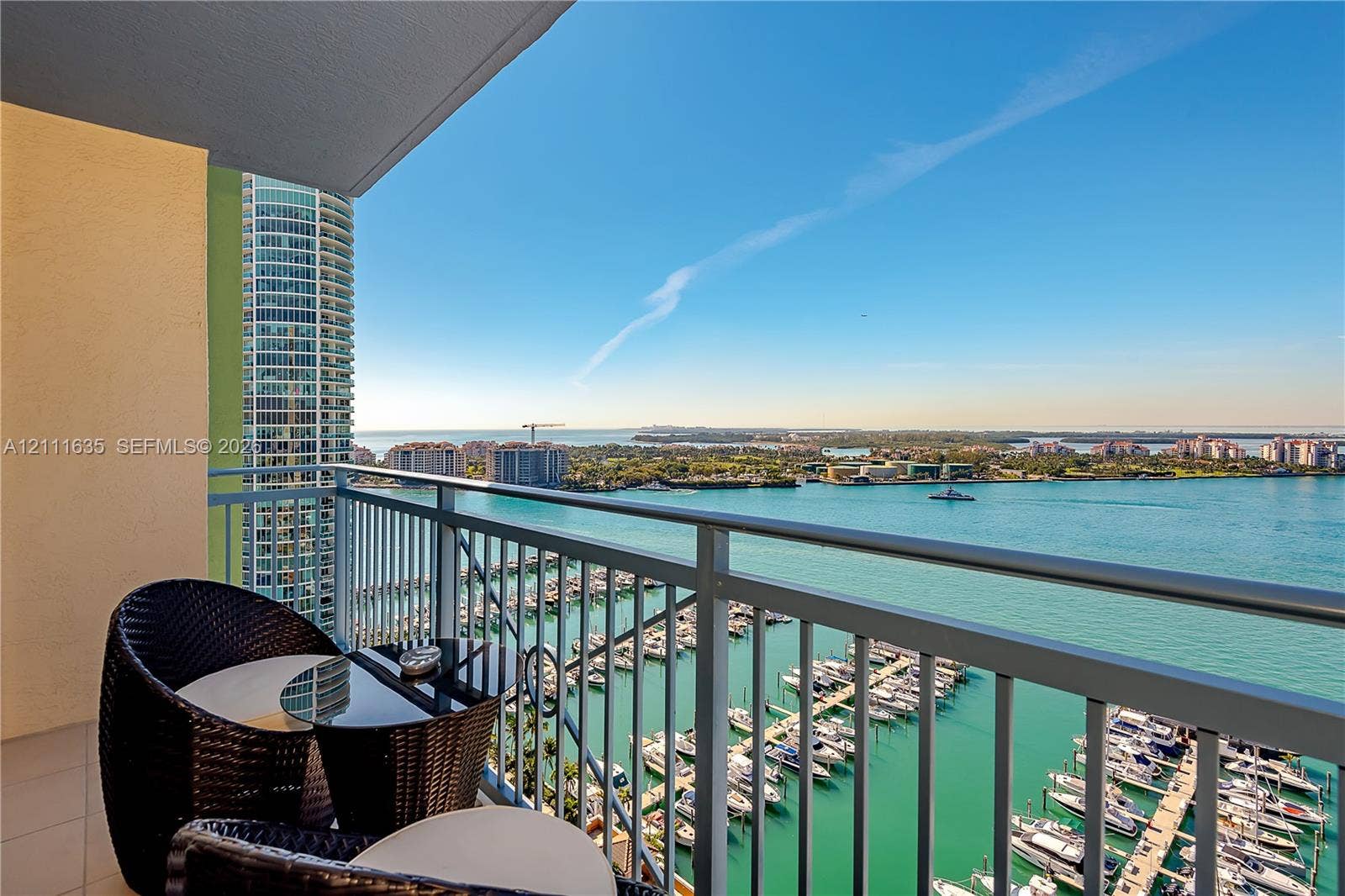 90 Alton Road, #2410, Miami Beach, FL 33139 Private balcony featuring a metal railing and tile flooring overlooking the harbor and waterfront