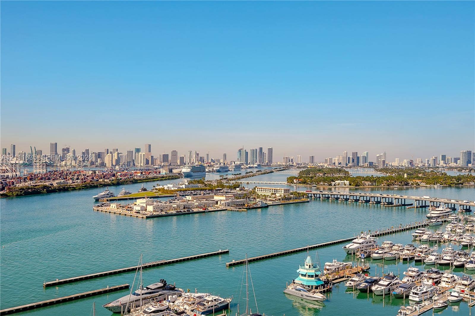 90 Alton Road, #2410, Miami Beach, FL 33139 Panoramic perspective of the city skyline, active harbor, and marina featuring multiple boat slips