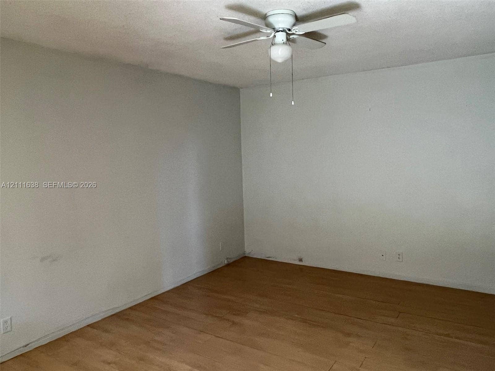 4841 SW 45th Avenue, #2, Hollywood, Hollywood, FL 33314 Interior space featuring wood-finish flooring and a ceiling fan with integrated light fixture