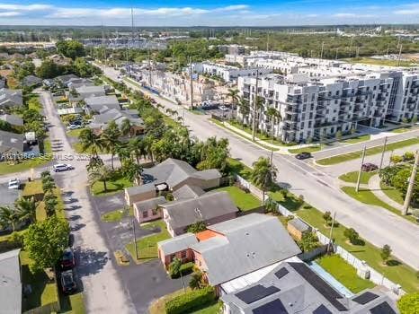 12801 SW 248th Terrace, Homestead, FL 33032 Aerial perspective featuring multi-story residential structures and established palm tree landscaping