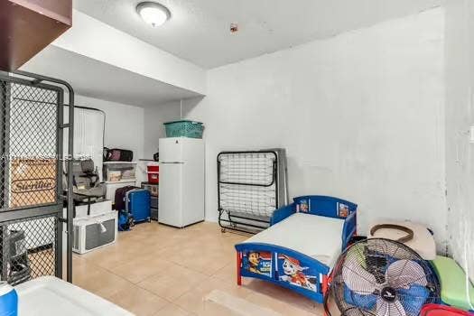 12801 SW 248th Terrace, Homestead, FL 33032 Tile flooring and flush-mount ceiling lighting