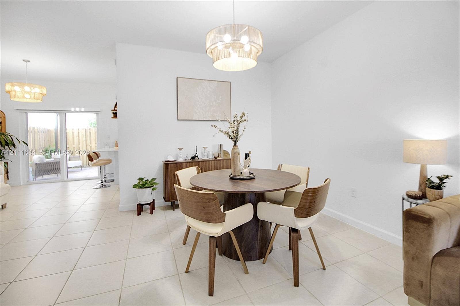 2873 SE 24th Avenue, Homestead, FL 33035 Large-format tile flooring, drum-style pendant lighting, and sliding glass doors