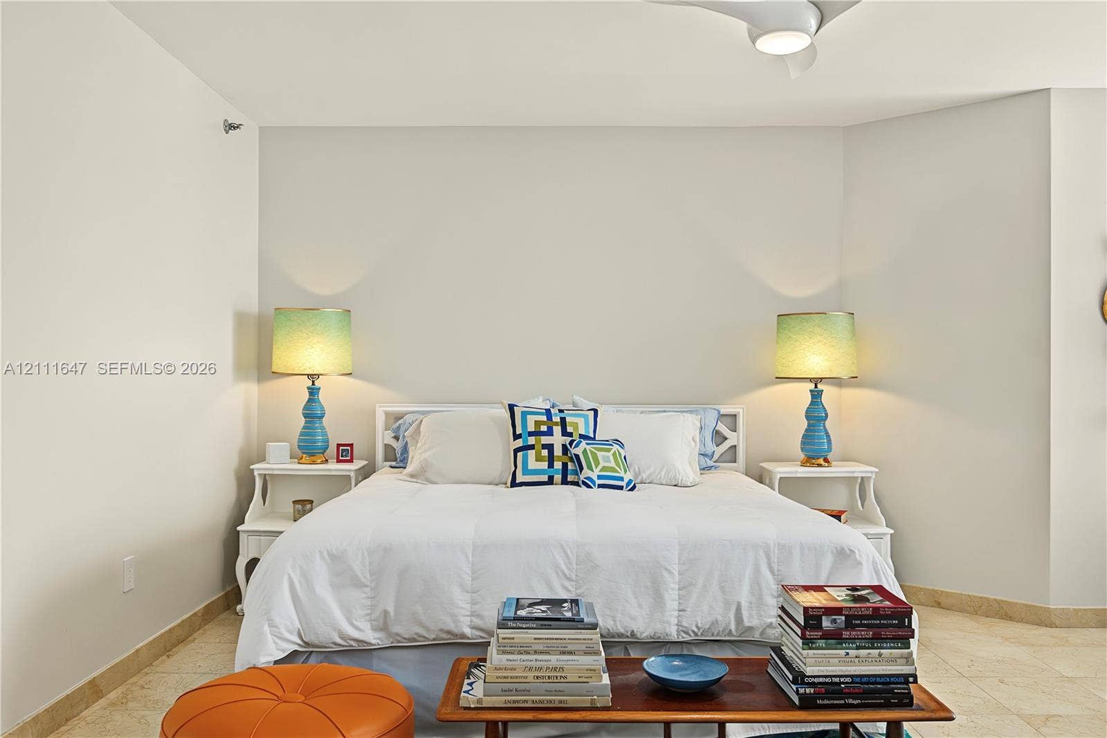 8925 Collins Avenue, #4J, Surfside, FL 33154 Neutral-toned interior space featuring stone-style flooring and an integrated ceiling fan with light fixture